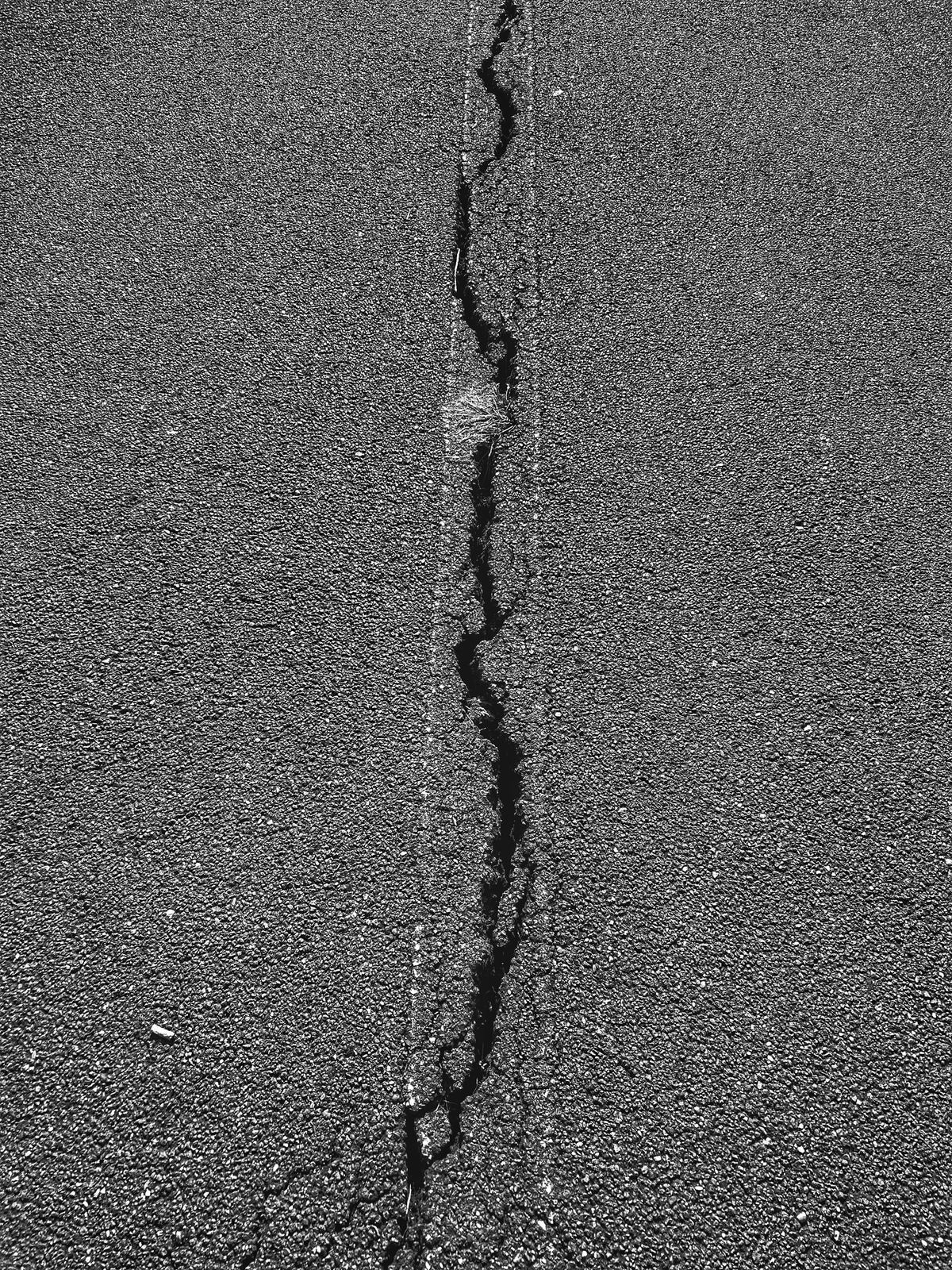 Asphalt surface with cracks ready for hot-applied sealant