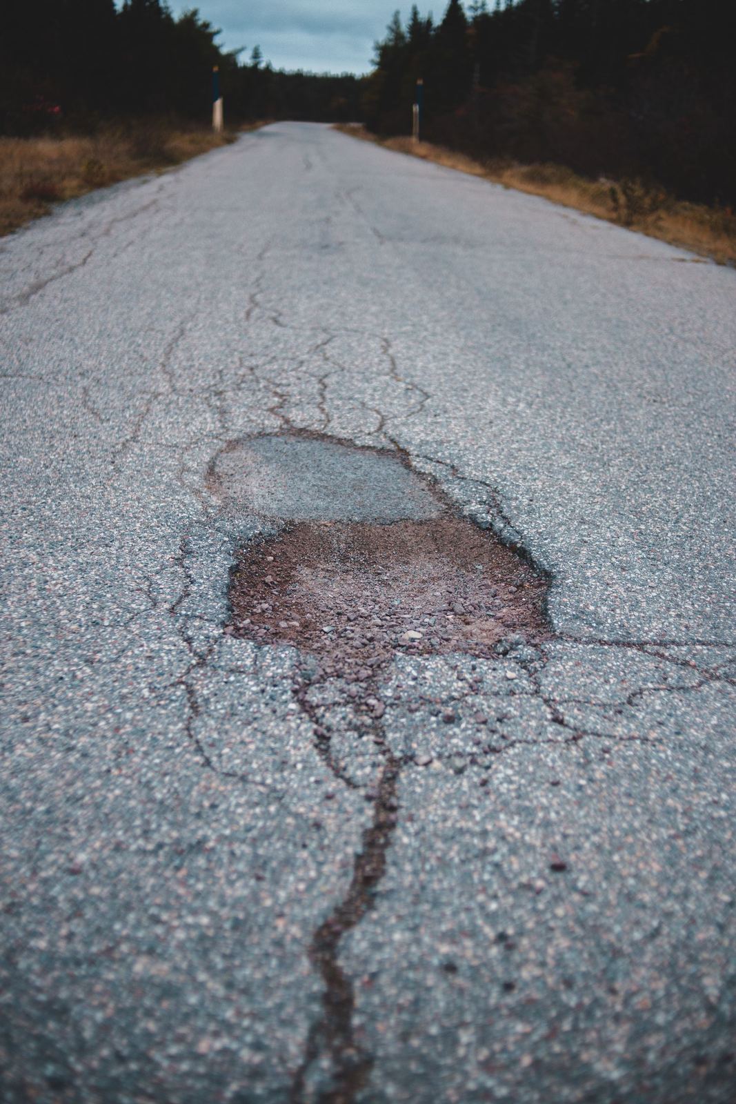 Pothole in asphalt pavement before repair