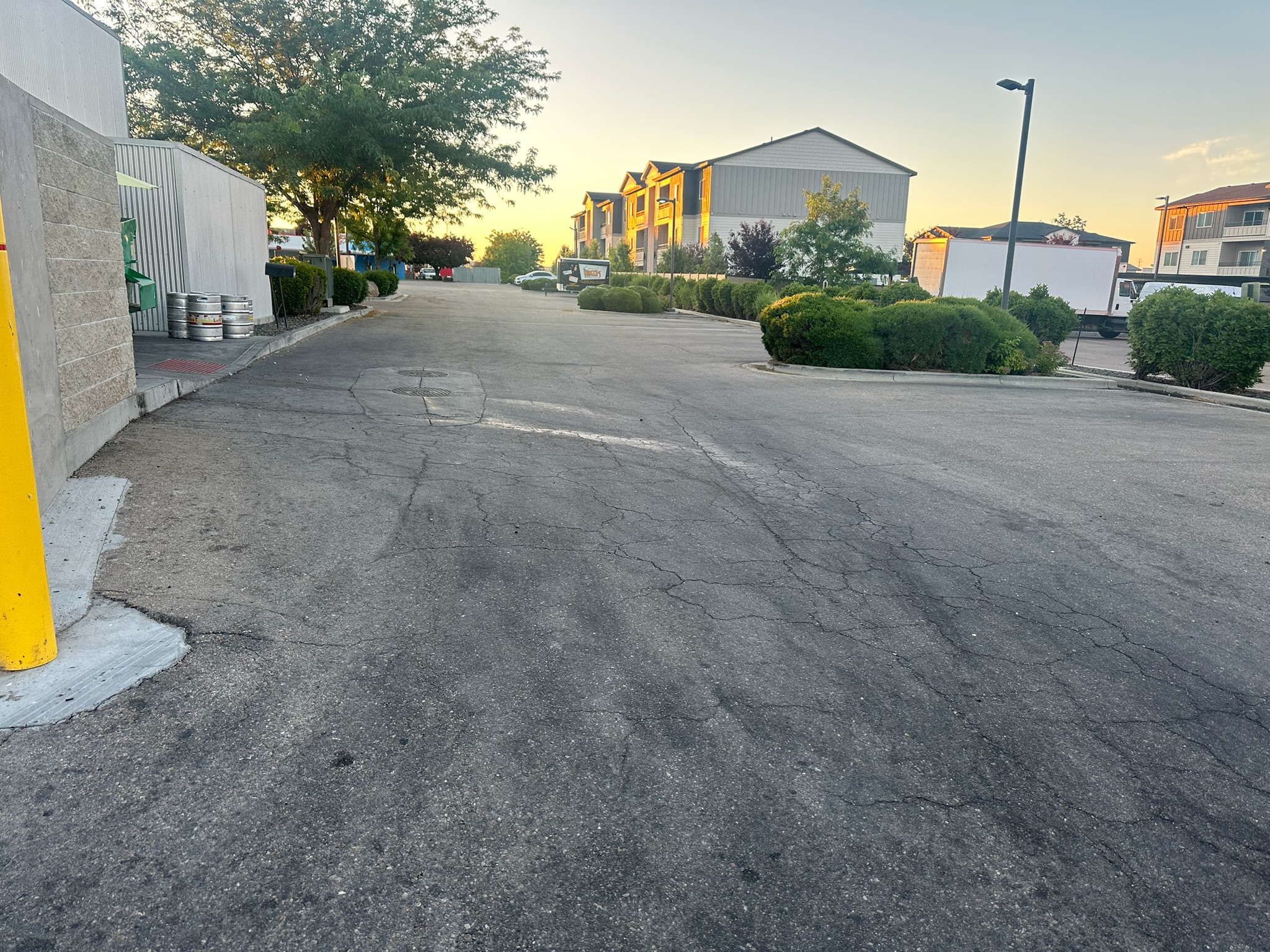 Damaged curb and pavement edge at an apartment complex prior to repair