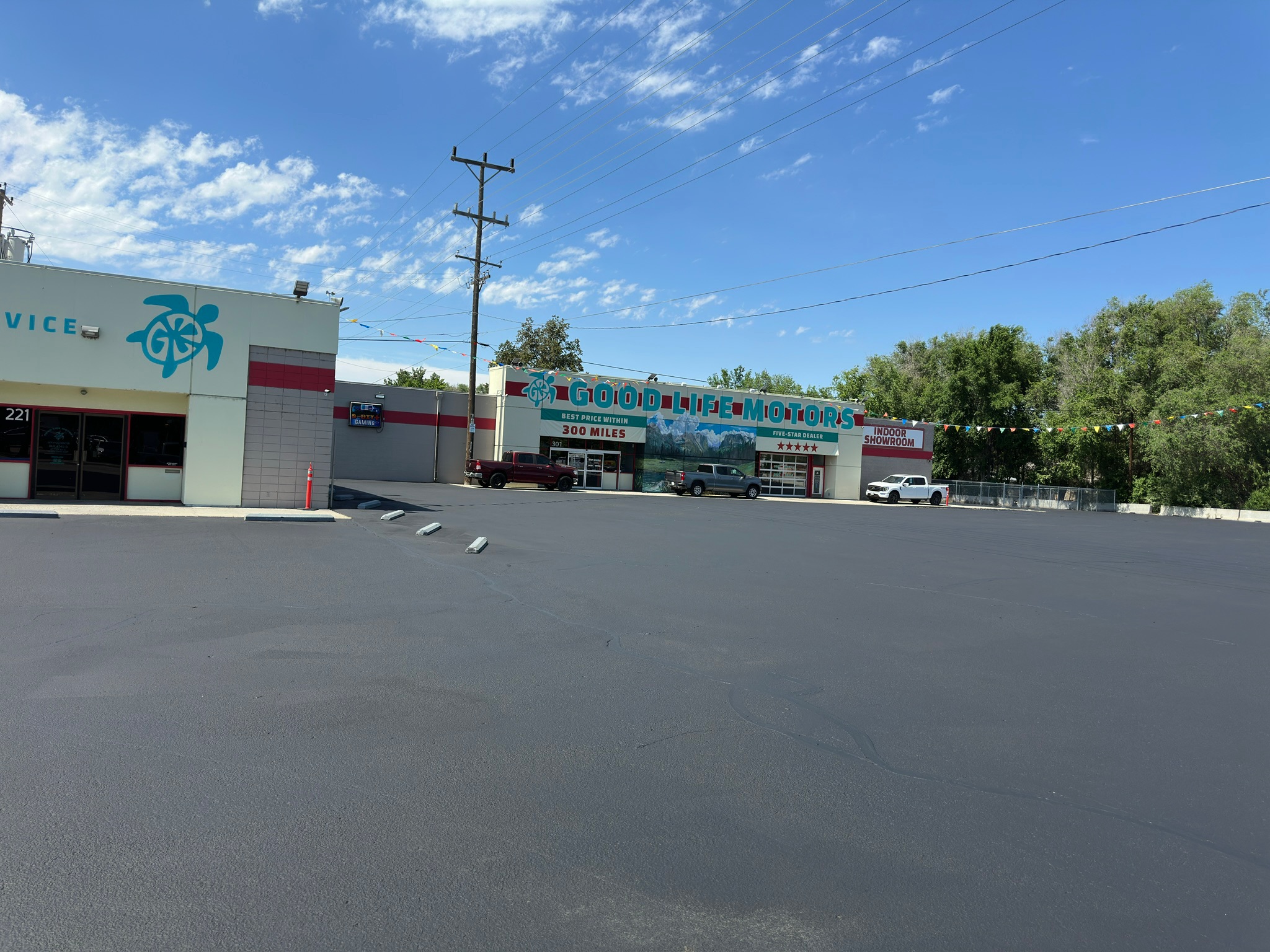 Commercial parking lot at Good Life Motors in Meridian, Idaho before sealcoating by Supreme Seal Coat