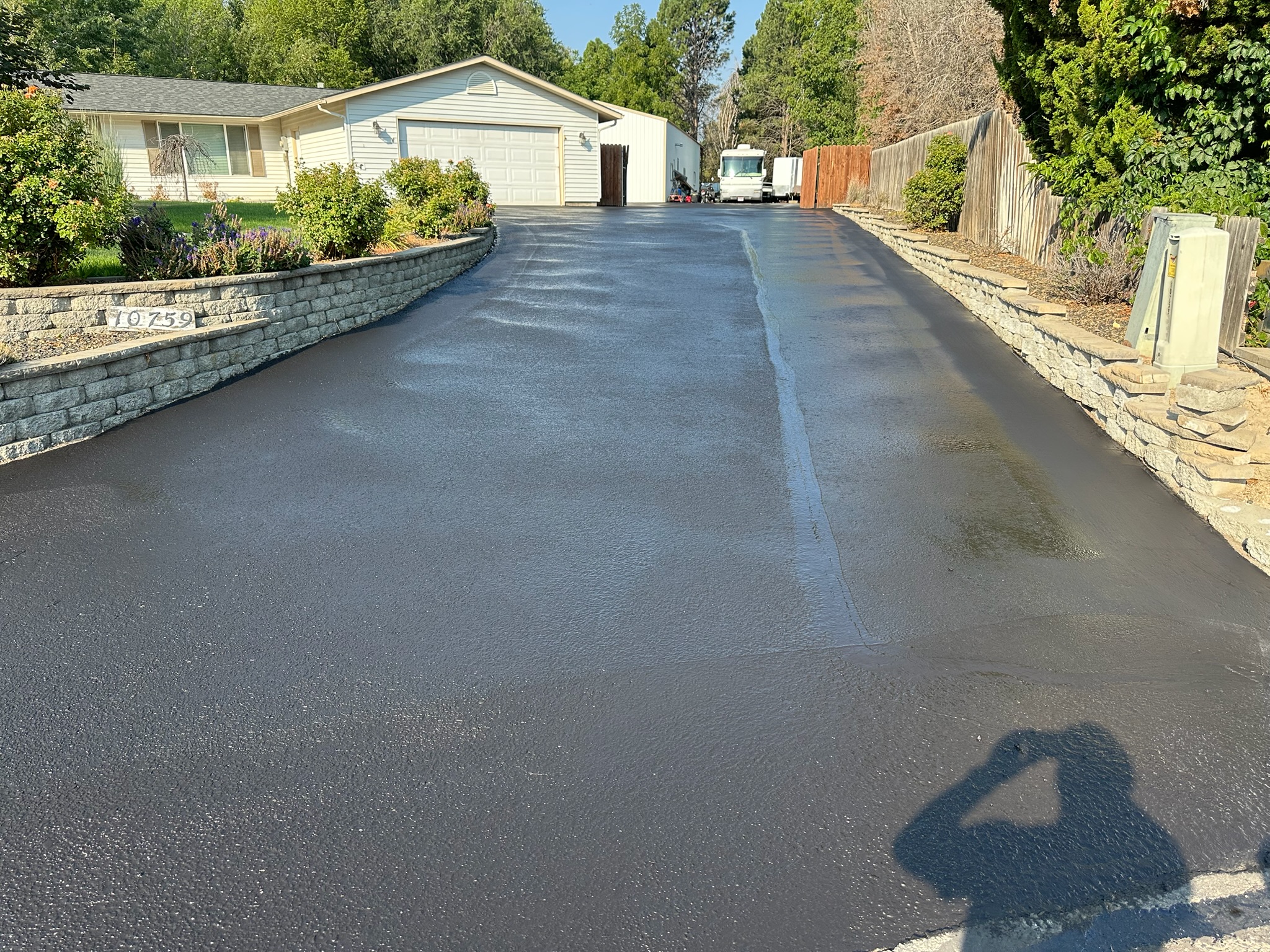 Wide residential driveway after sealcoating by Supreme Seal Coat