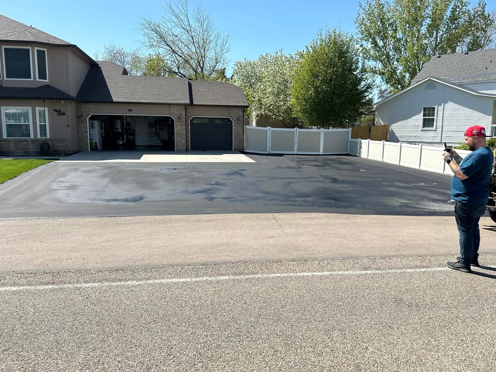Residential driveway with smooth finished sealcoat by Supreme Seal Coat