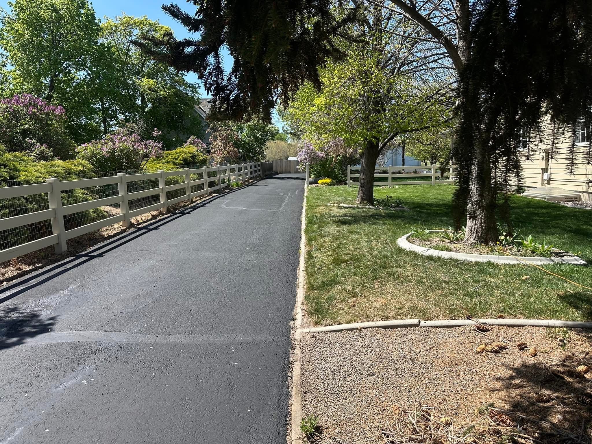 Freshly sealcoated residential driveway by Supreme Seal Coat in the Treasure Valley