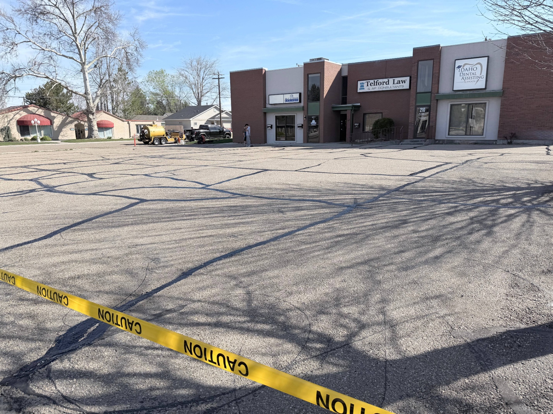 Hot-applied crack filling in progress at a Treasure Valley commercial property