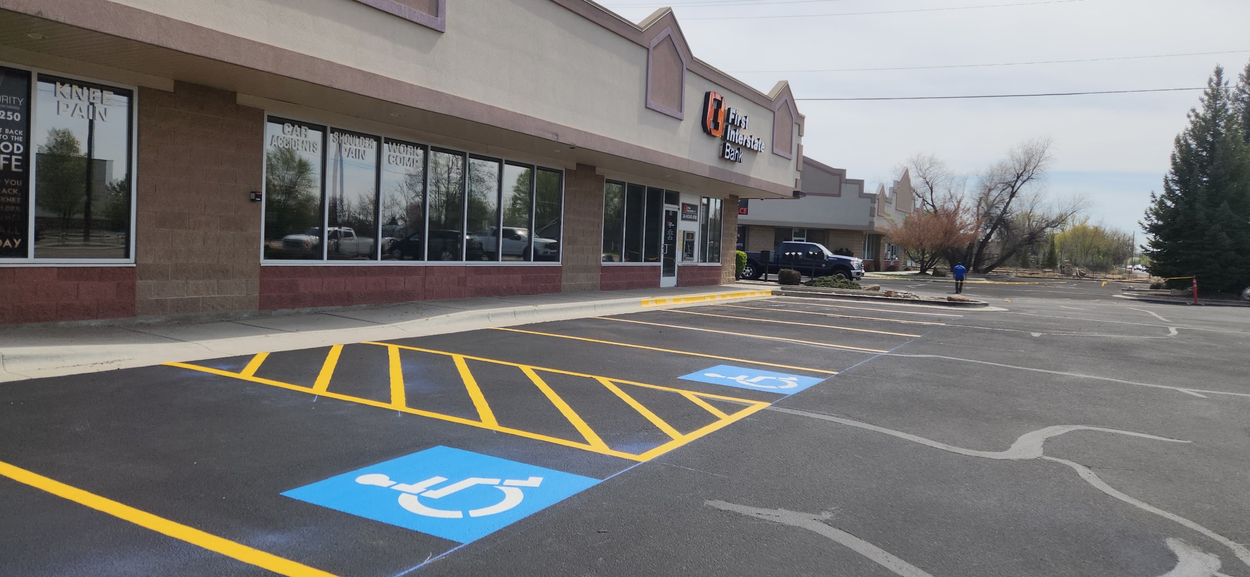 Commercial parking lot with ADA-compliant accessible stall striping by Supreme Seal Coat